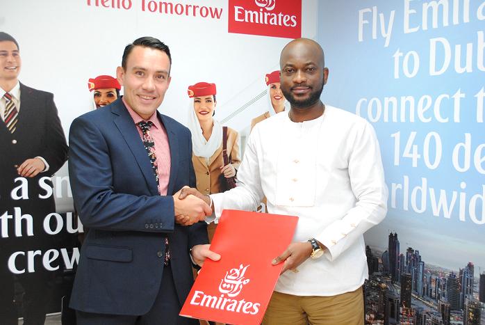 the country director of emirates  airlines in a handshake with Ag. CMO of…