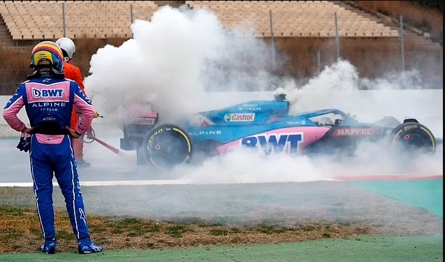 Former world champion Fernando Alonso’s car goes up in smoke on final day of testing in Barcelona