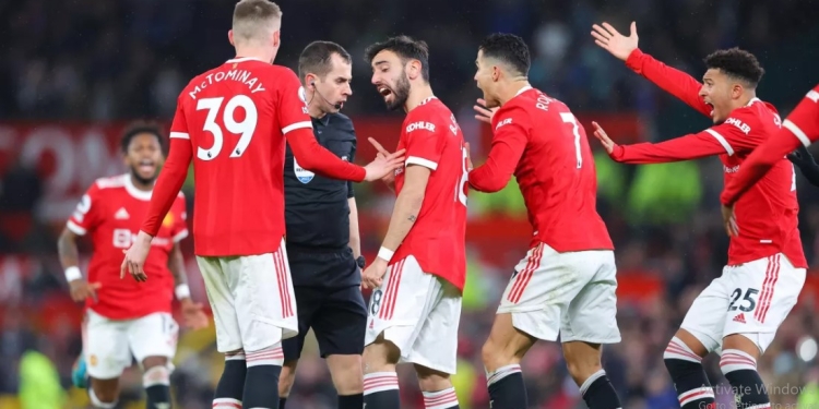 Manchester United charged by FA after players surrounded referee Peter Bankes during Brighton win