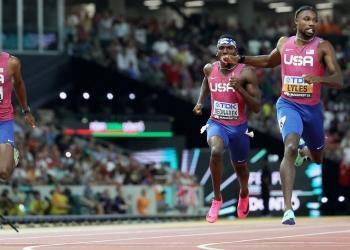 Lyles completes sprint double with third consecutive world 200m title