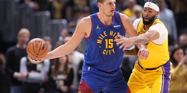 Jokic and the Nuggets receive rings, watch championship banner raised before tipping off season