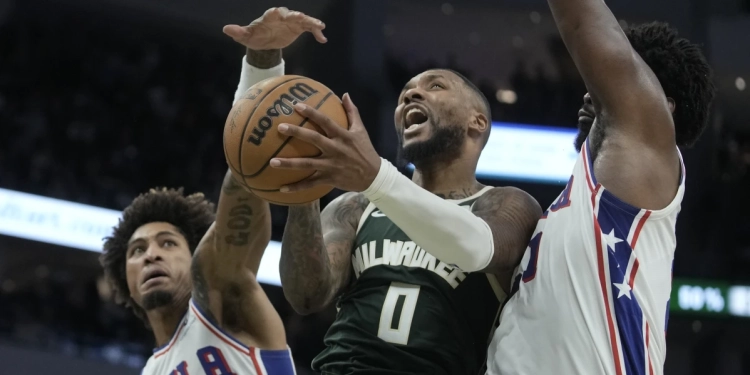 Lillard sets Bucks record with 39 points in a debut, leads Milwaukee past Philadelphia 118-117