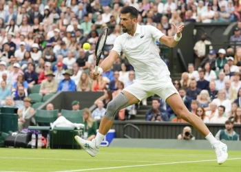 Novak Djokovic wins his first match at Wimbledon with a sleeve on his surgically repaired knee